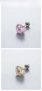 Macro detail of pink and champagne octagonal cut zircon studs with titanium screw backs