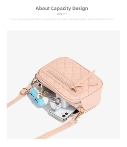 Detailed view showing the spacious capacity of this pink quilted crossbody camera bag