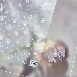Adesivi per unghie con pizzo floreale bianco e motivi di fiocchi delicati