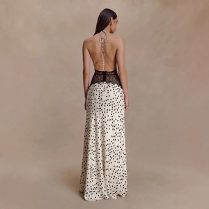 Elegant backless maxi dress featuring black lace bodice and beige polka dot patterned skirt