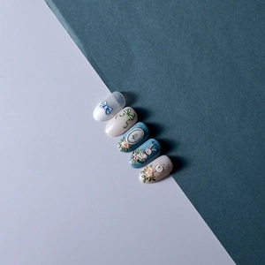 Close-up of 5D relief nail art stickers with vintage bows and floral rabbit patterns