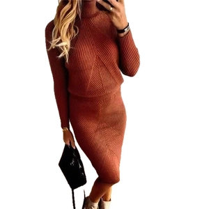 Detail of caramel ribbed knit two-piece set featuring a turtleneck sweater and midi skirt