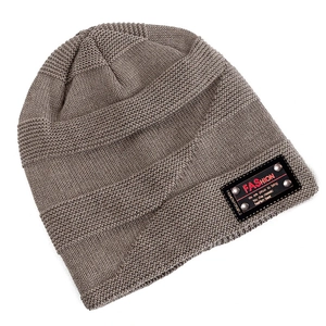 Detail showing wavy knit texture and leather patch with rivets on a grey beanie hat