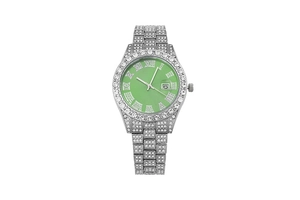 Detail of iced-out silver watch featuring green dial and sparkling diamond bezel