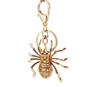 Creative spider keychain in golden metal finish with sparkling rhinestone crystal inlay