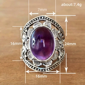 Vintage bohemian silver ring with purple oval gemstone and floral carvings