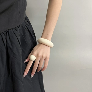 Minimalist cream white resin ring and bracelet set styled on female model
