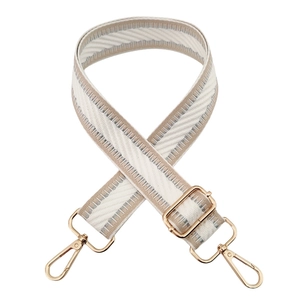 Detail of woven beige and silver strap with premium gold swivel hooks and metal hardware