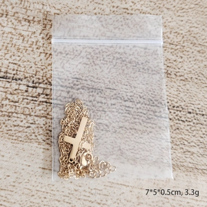 Polished titanium steel cross pendant necklace in gold finish with square chain link