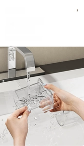 Detail showing the detachable design of the transparent storage cup for easy cleaning