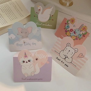 Detailed view of colorful cartoon animal greeting cards with unique die-cut animal shapes