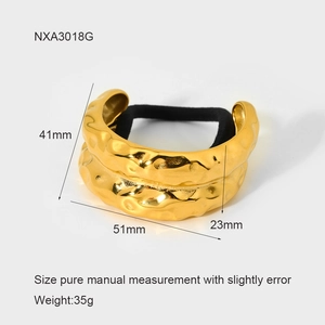 Detail view of golden textured hair cuff with precise product dimensions and weight specs