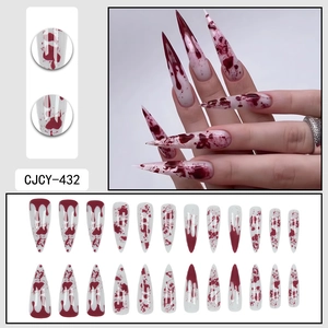 Long stiletto press-on nails with white base and red blood drip Halloween design