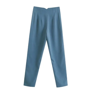 Detailed flat lay of high-waisted wide leg trousers in dusty blue premium fabric