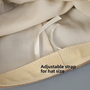 Detail view of cotton linen hat with adjustable string for customizable head size