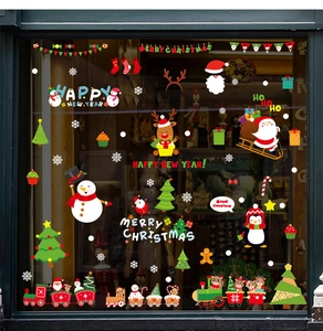 Detail view of colorful Christmas window stickers with Santa, snowman and holiday train