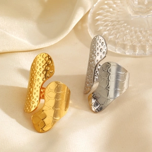 Chic wide geometric open rings in 18K gold and silver finishes on silk background