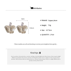 Detailed size and material chart for hollow petal earrings with cubic zirconia