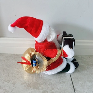 Detailed side view of a 30cm musical Santa Claus figure playing a black accordion toy