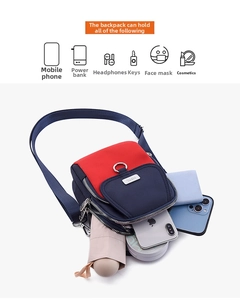 Detailed view of spacious nylon crossbody bag compartments with organized daily essentials