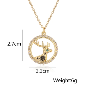Detail view of a gold-plated reindeer pendant with zircons and 2.2x2.7cm dimensions