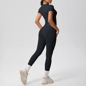 Back view of a black two-piece yoga set showing slim fit athletic T-shirt and leggings