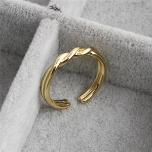 French style twisted rope open ring in gold finish on grey velvet jewelry box display