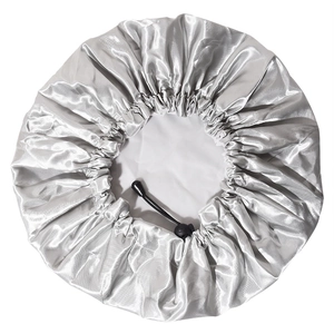 Close-up of silver-grey satin shower cap with adjustable black drawstring and PEVA lining