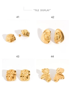 Macro view of four textured 18K gold-plated geometric stud earrings in diverse irregular shapes