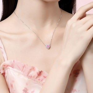 Elegant S925 silver necklace with pink heart gemstone pendant worn by a model