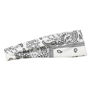 Close-up of white paisley print sports headband with a stylish twist knot detail