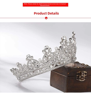 Detailed macro view of silver bridal crown with crystals on vintage wooden jewelry box