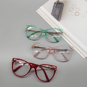 Cat eye glasses frames with metal spring legs in transparent green, pink, and red colors
