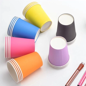 Colorful disposable paper cups for coffee and parties in yellow, pink and blue tones