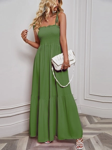 Detail of green strapless tiered maxi dress with ruched bodice and shoulder ties