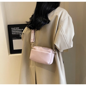 Pink PU leather crossbody bag with geometric pattern wide strap and gold hardware accents
