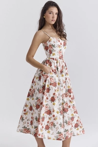 Detail view of the side pocket on the floral sundress with red flower prints