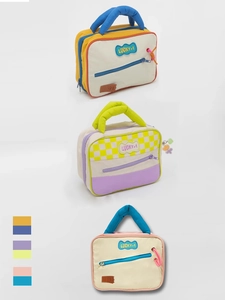 Detailed comparison of color-block cosmetic bags with Lucky+1 patches in studio lighting
