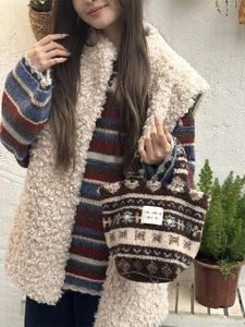 Fuzzy sherpa tote bag with floral embroidery and earth-tone stripes for winter