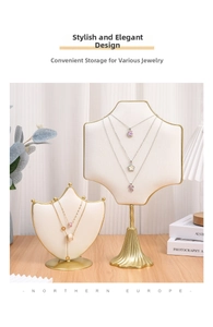 Detailed view of luxury velvet jewelry display stands with elegant gold metal frames and bases
