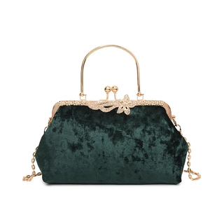 Elegant emerald green velvet evening shell bag with gold metal handle and floral clasp