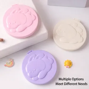Portable cartoon folding hairbrush mirror set in pastel pink, white and purple tones