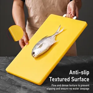 Thickened yellow PE plastic cutting board with dual-sided anti-mold surface and metal handle