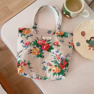 Vintage floral cotton handbag with Simple Wish tag in a cozy lifestyle setting