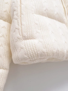 Close-up of high-quality white knit fabric texture and soft weaving pattern details
