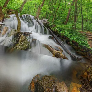 Close-up of high-definition waterfall landscape print on fabric tapestry texture