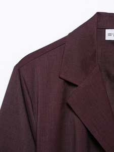 Close-up of wine red satin shirt collar and shoulder showing premium fabric texture