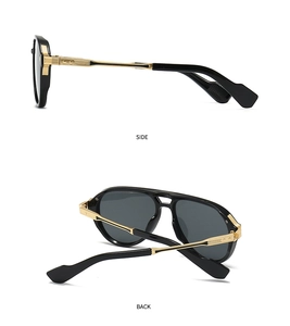 Detail of aviator sunglasses with gold metal temples and textured side stripe hinges