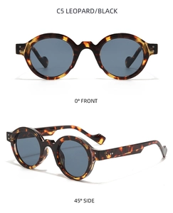 Detalle de gafas de sol redondas retro de leopardo con lentes grises y marcas de modelo C5