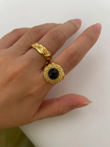Detailed close-up of retro 18K gold-plated ring set with natural black stone inlay